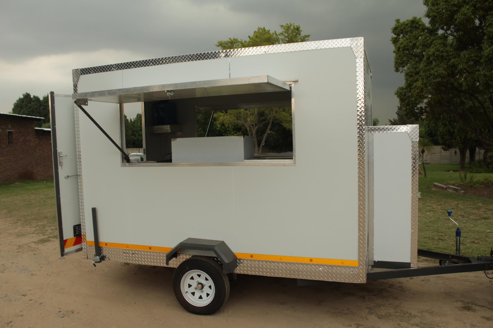 Ndlela Projects Mobile Kitchen — Side view of serving hatch