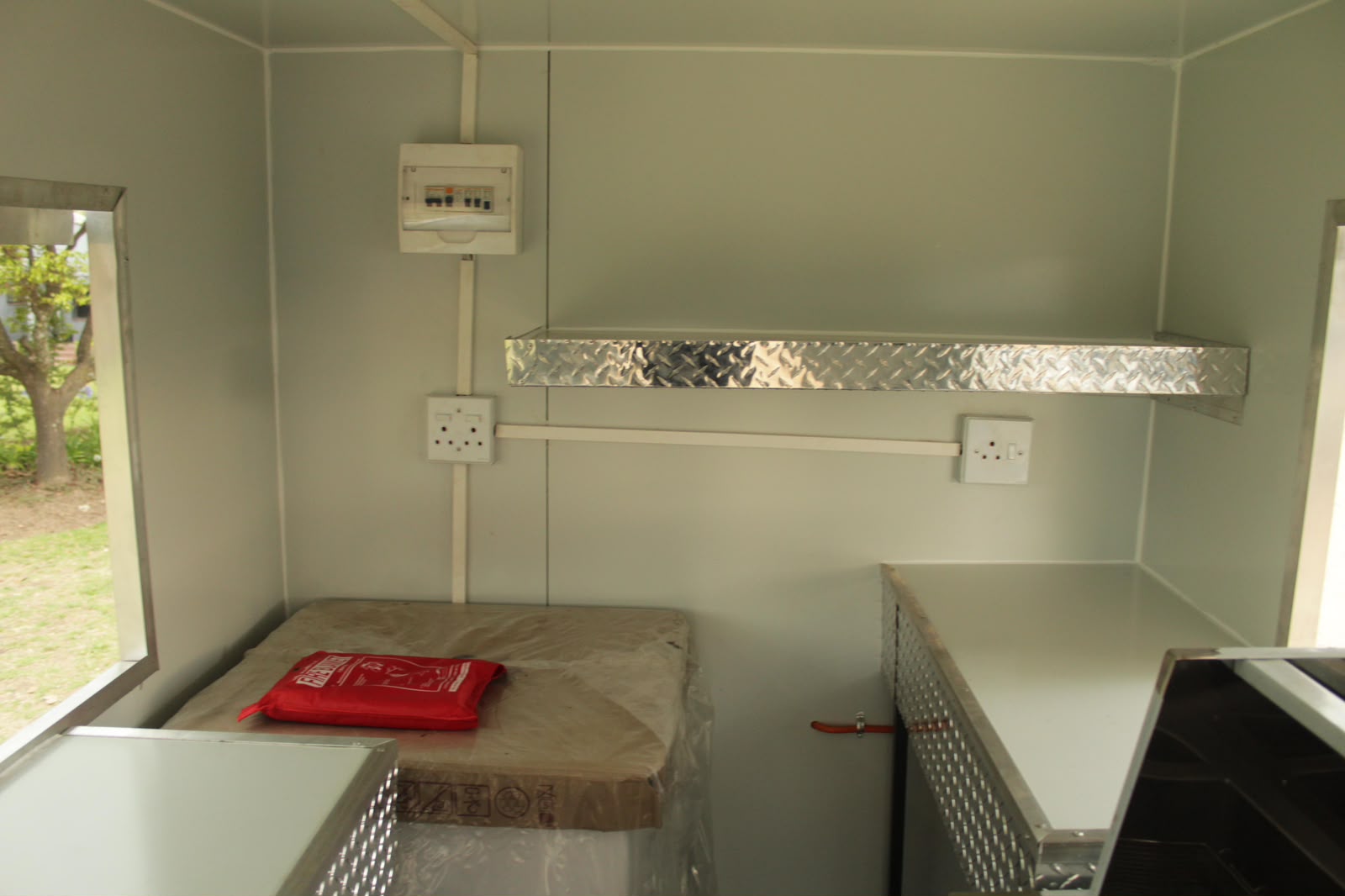 Ndlela Projects Mobile Kitchen — Electrical board and storage shelving